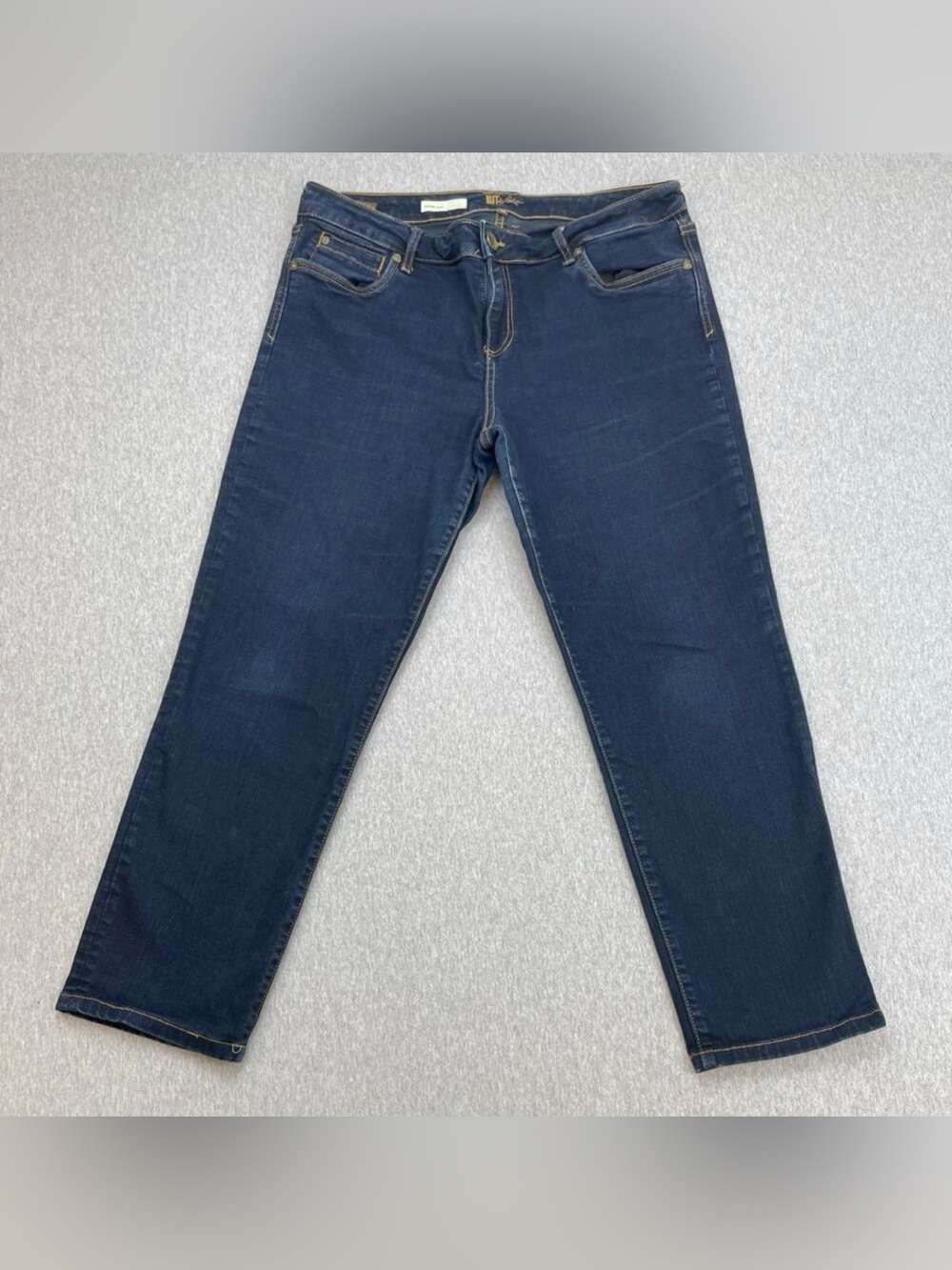 Kut from the Kloth “Diana” skinny ankle jeans in dark blue with stretch.